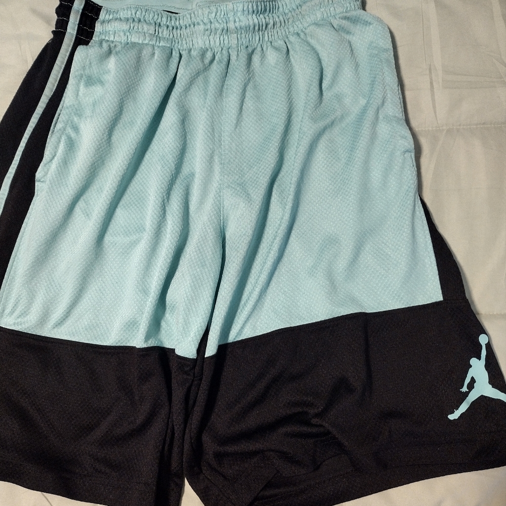 Jordan Teal an black shorts